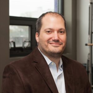 Portrait of Dr. Christian Carollo, DC, chiropractor and medical director at Prestige Health & Wellness Chelsea