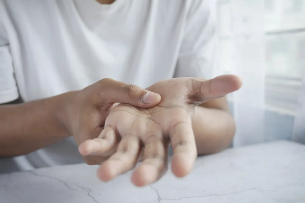Hand therapy session at a Manhattan chiropractic clinic, NYC, focusing on joint pain relief