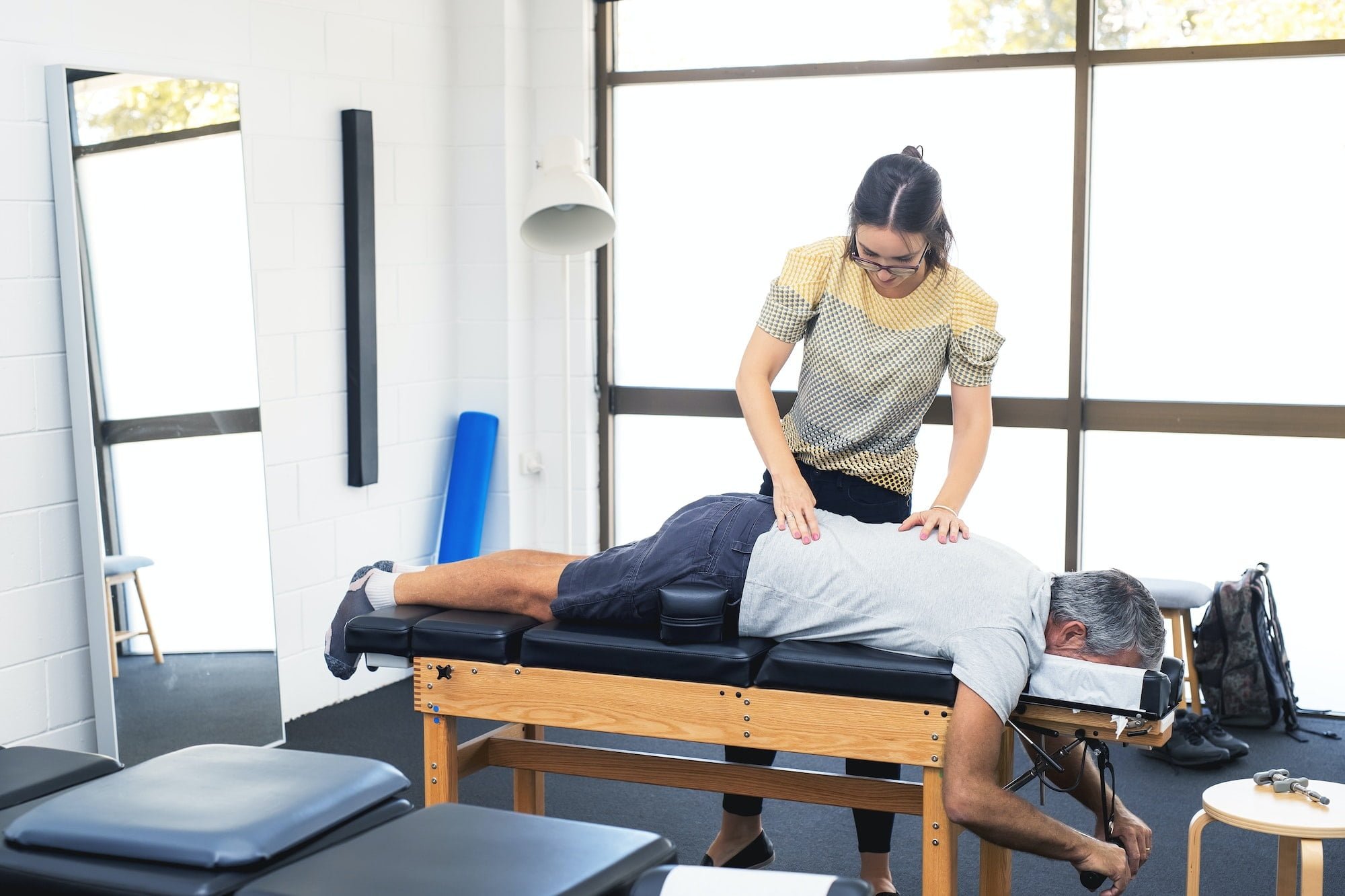 Senior man having chiropractic adjustment.