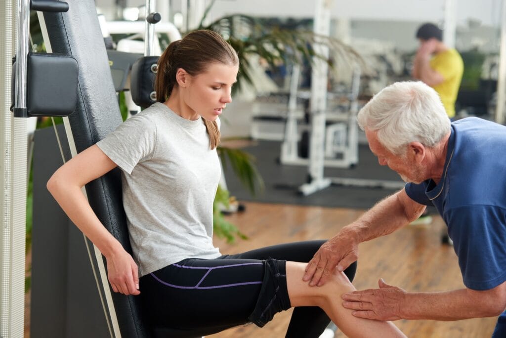 Woman with joint pain in gym