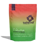 Tailwind Endurance Fuel bag in the Dauwaltermelon with Lime flavor, featuring a red-to-green gradient pouch with the Tailwind logo and product labeling.
